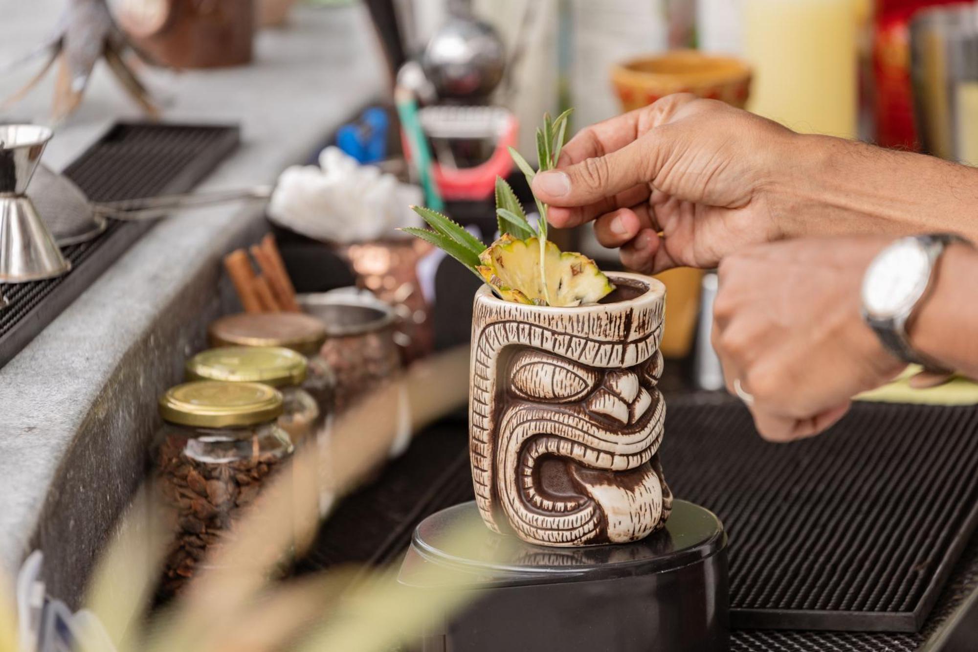 Skyview Resort Phuket Patong Beach Extérieur photo A tiki drink being garnished